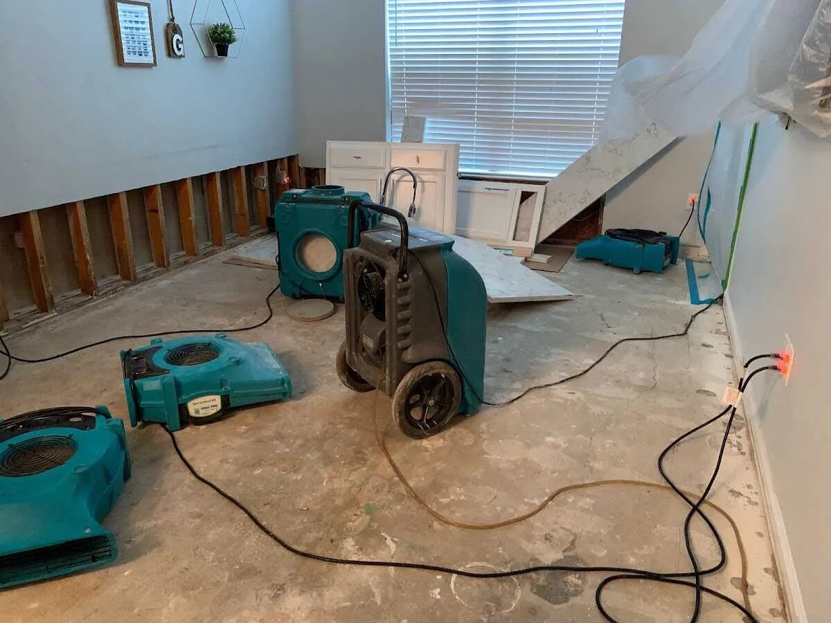 Dehumidifier in flood-cut room for Water Damage Restoration in Town 'n' Country